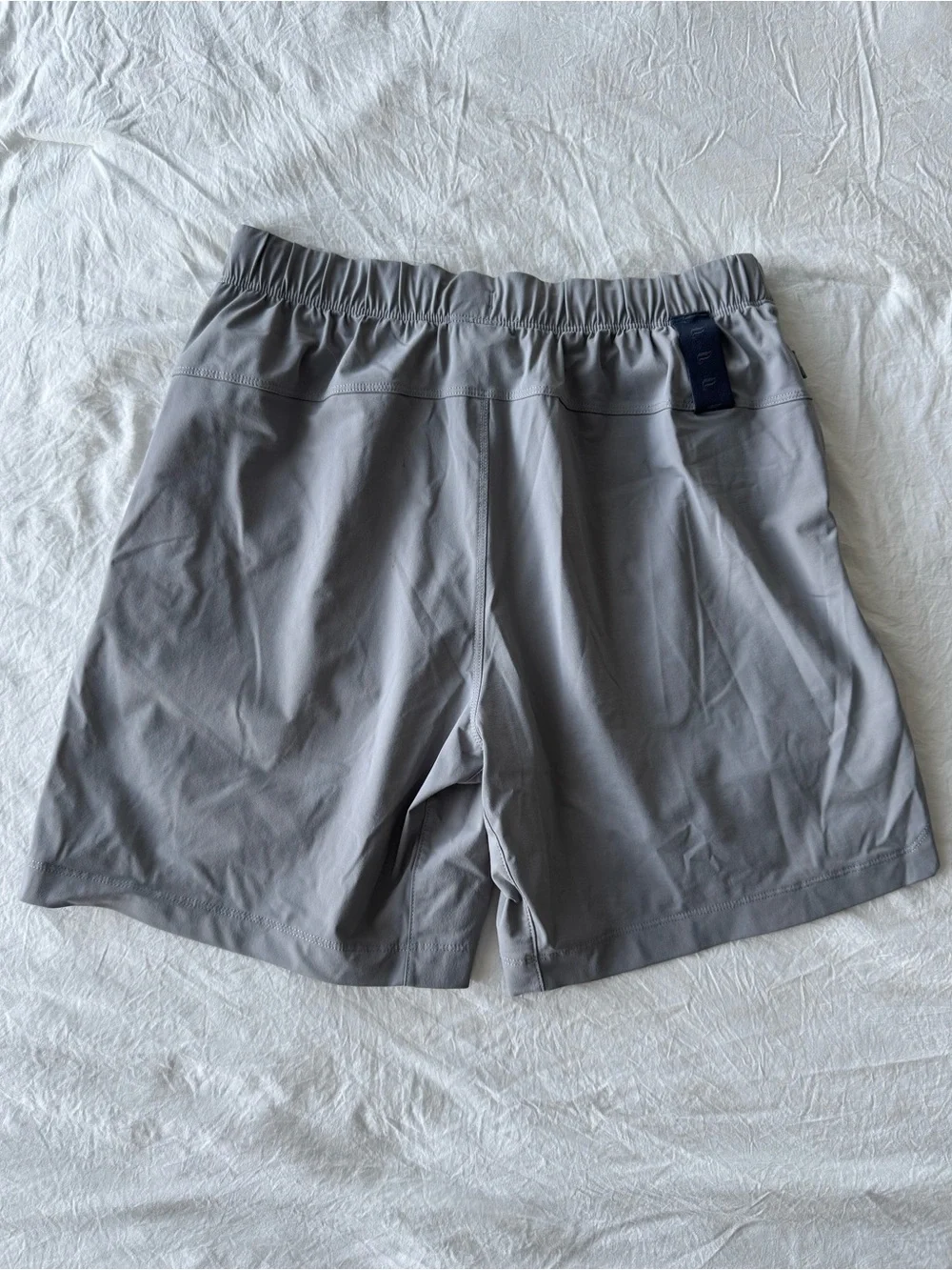 Fabletics Men's Light Gray Athletic Shorts with Navy Drawstring